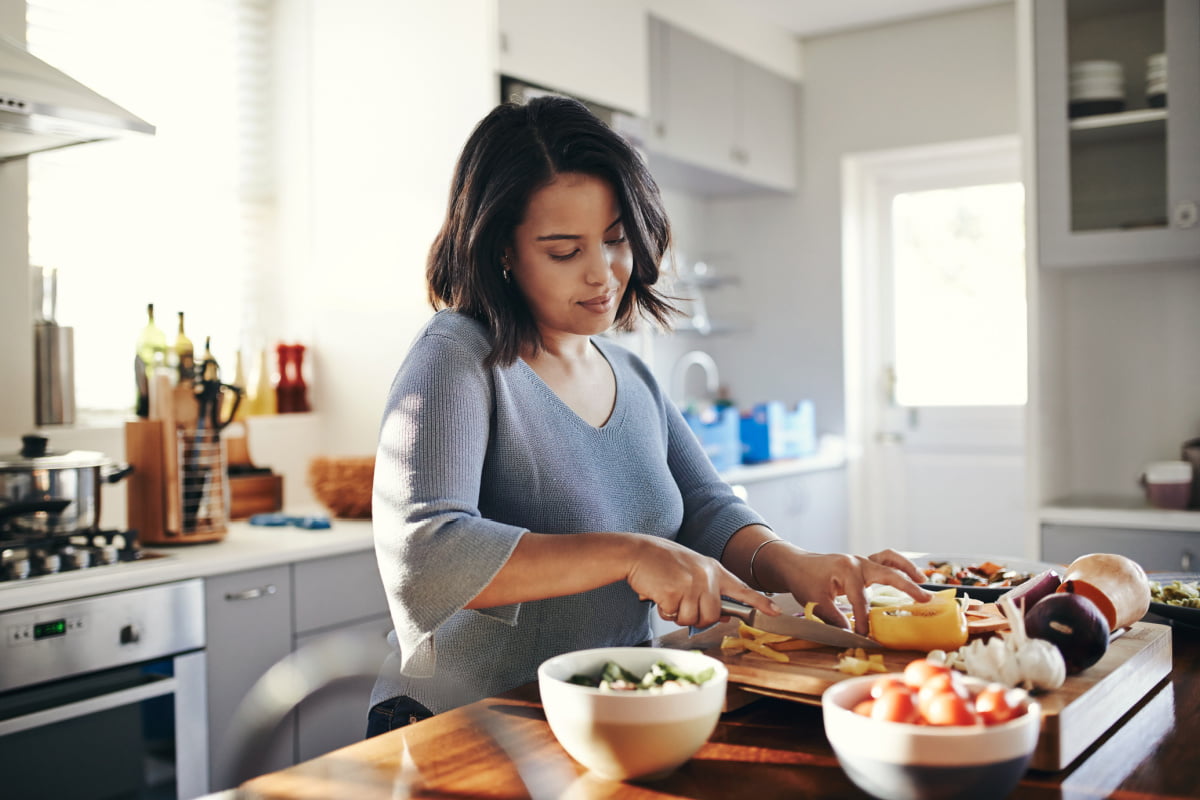 Woman with diabetes preparing meal with her favorite low glycemic foods