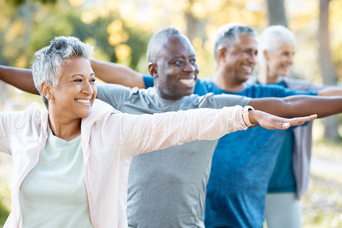 Group of seniors doing tai chi to stay fit and healthy