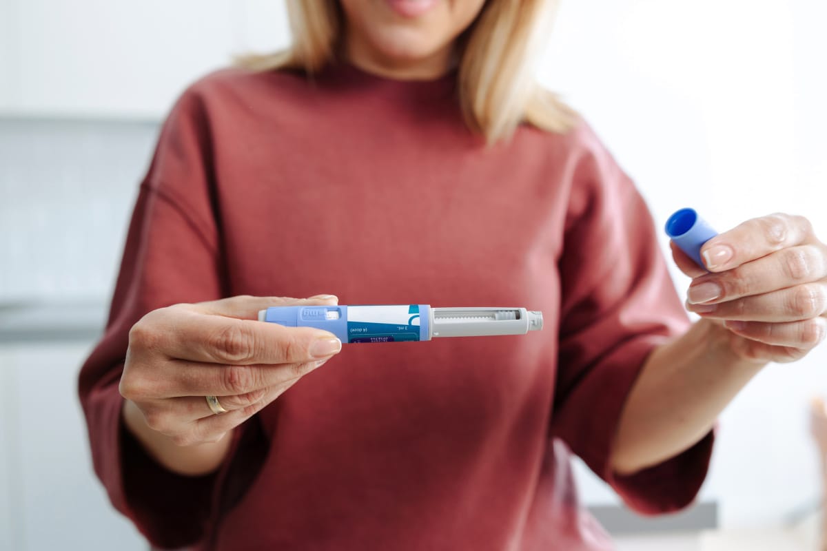 Woman with GLP-1 weight loss injection medication